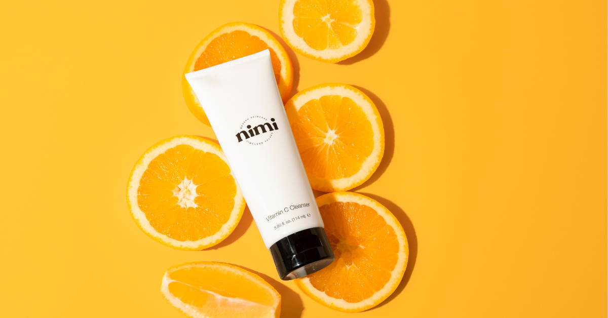 Nimi's Vitamin C Cleanser on top of sliced oranges 